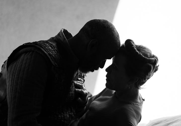 Depicted in black and white, Denzel Washington as Macbeth and Frances McDormand as Lady Macbeth