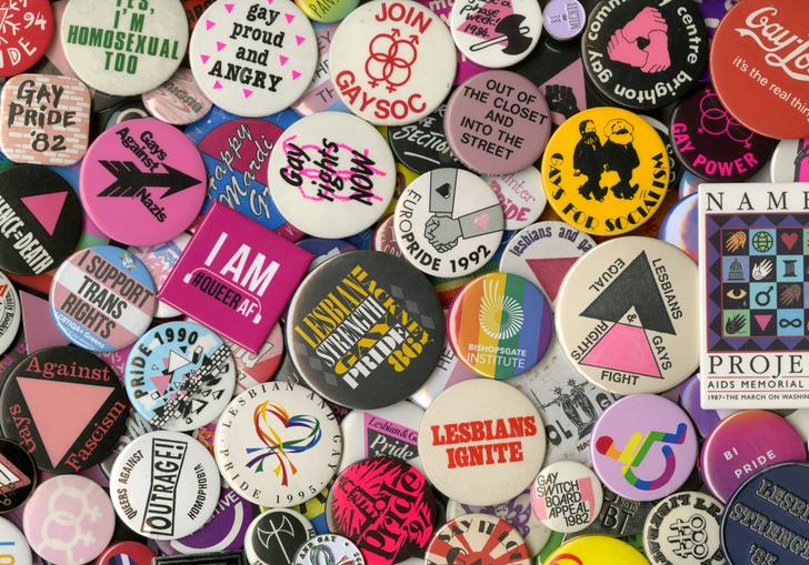 A pile of colourful badges celebrating LGBTQ+ individuals, collectives and organisations.