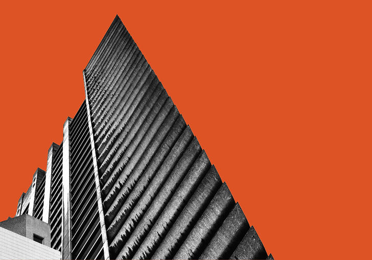 Barbican tower against orange background