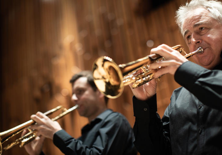 Trumpeters from Britten Sinfonia playing their instruments