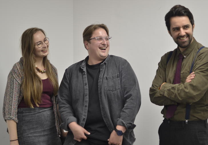 Composers Aileen Sweeney, Jonathan Brigg and Nathan James Dearden standind together laughing