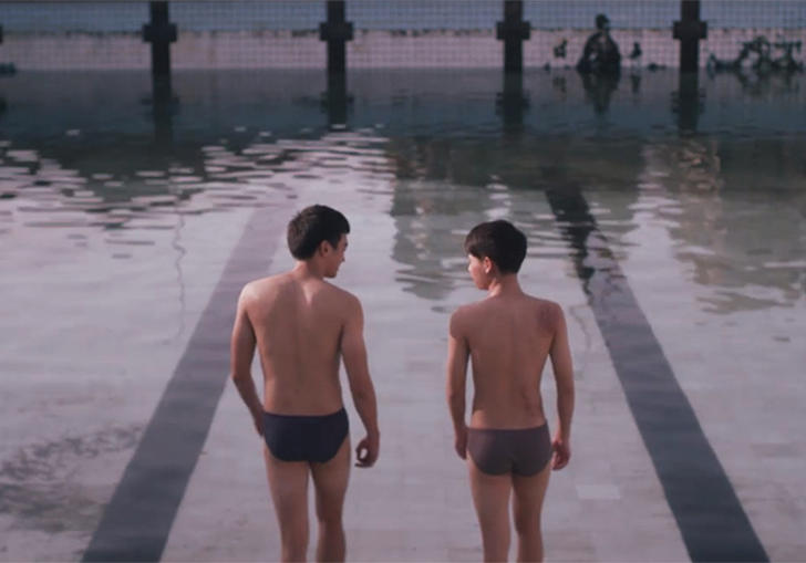 Two men in trucks at the edge of a swimming pool in The Blue Hour