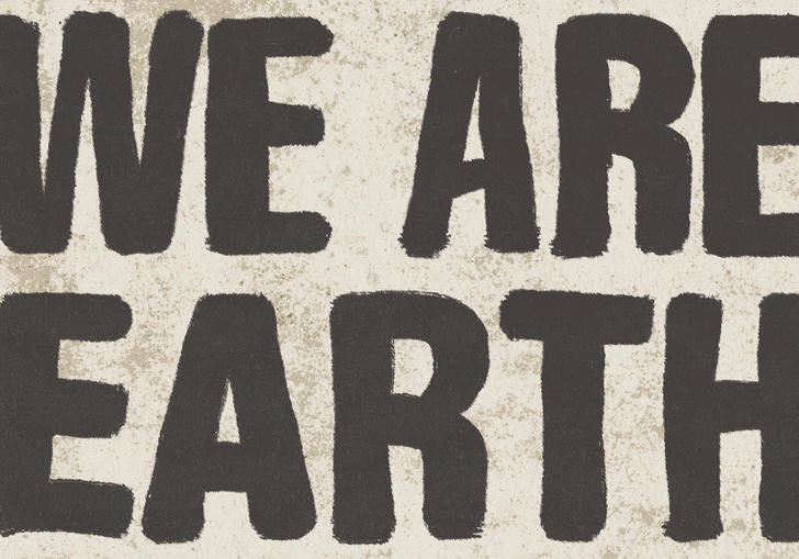 A cream background with text in black that says 'We are earth' all in capital letters