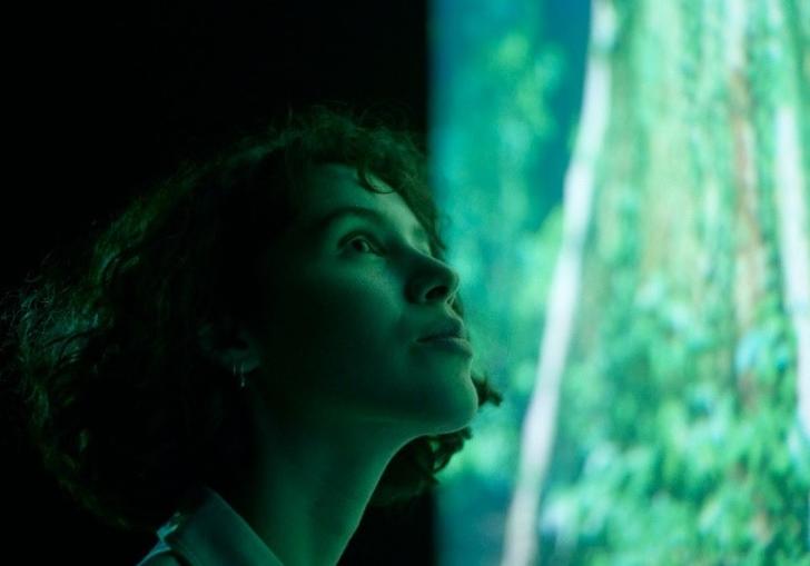 Person looking at Marshmallow Laser Feast installation