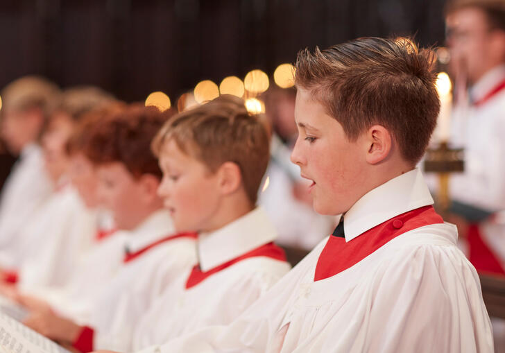 Members of the King's College Choir, Cambridge, sing in their cassocks
