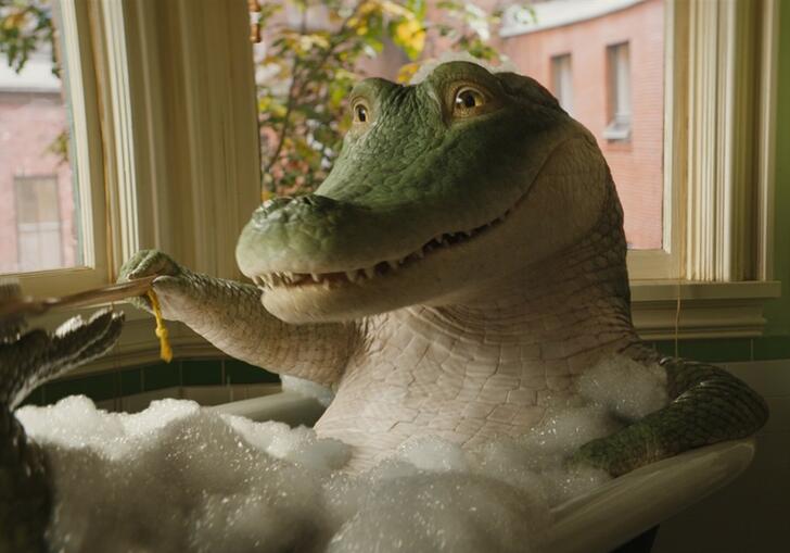 a crocodile lying in a bath