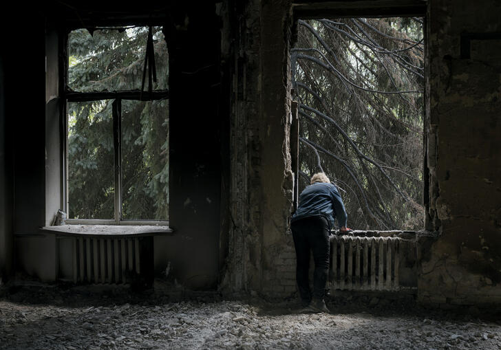 Man stands at a window