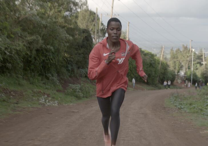 An athlete trains on a road 