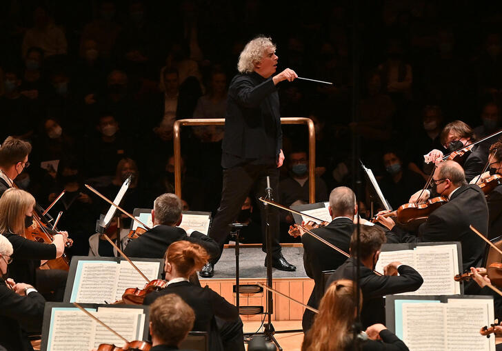 Sir Simon Rattle conducting