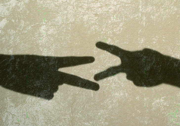 Shadow of two hands forms a still from Francis Alys' Children's Game
