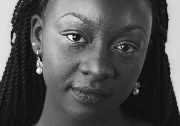 Black and white headshot of Temi Oh