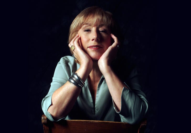 Norma Winstone sitting on chair with hands close to face