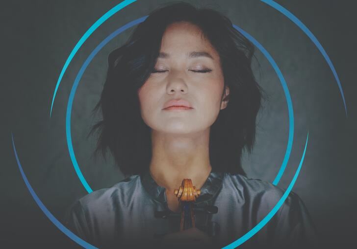 Sayaka Shoji with her eyes closed, and circular blue swirls framing her head