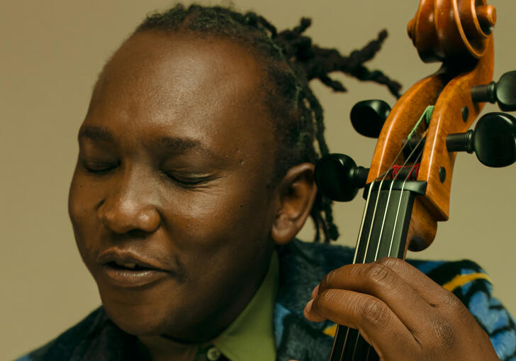 Close up photo of Abel Selaocoe playing his cello