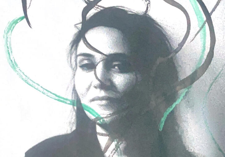 Grainy, greyscale photo of Freya Waley-Cohen overlaid with grey and turquoise paint swirls