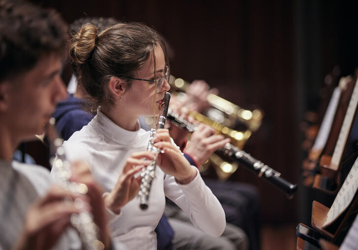 Woodwind section with focus on flautist