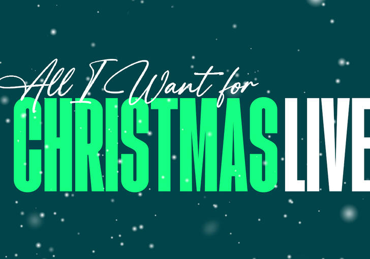 The words All I Want for Christmas Live against a teal background, flecked with snow