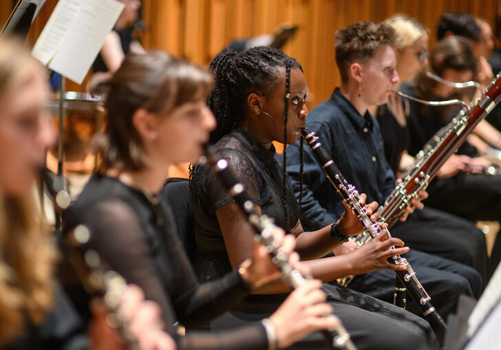 Musicians from the wind section of the LSSO, with clarinets in the foreground and bassoons in the background.