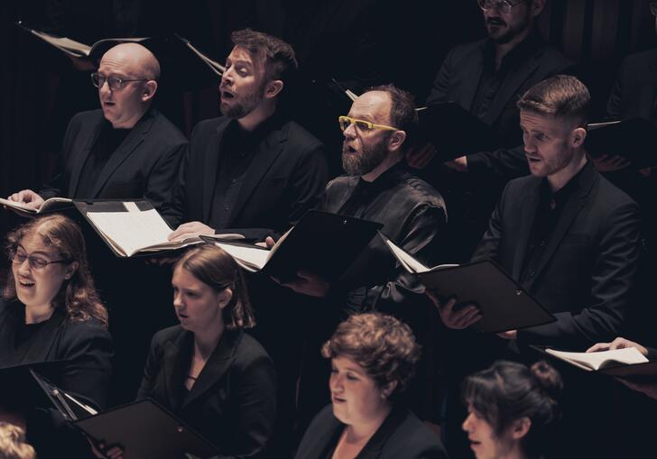 Members of the Fourth Choir singing on stage