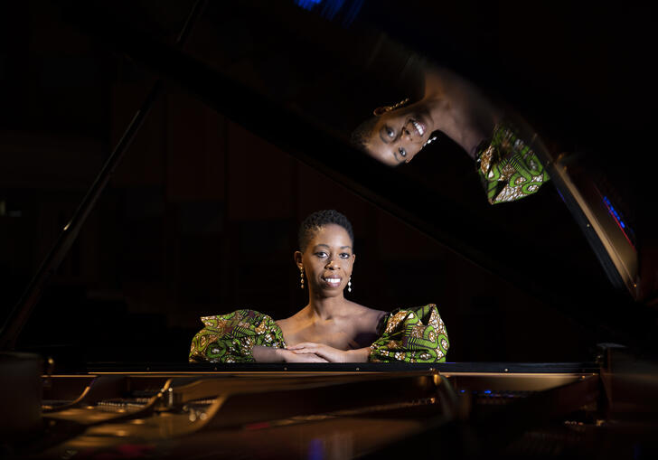 Samantha Ege sat in front of a grand piano