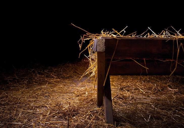 a manger in a dark room