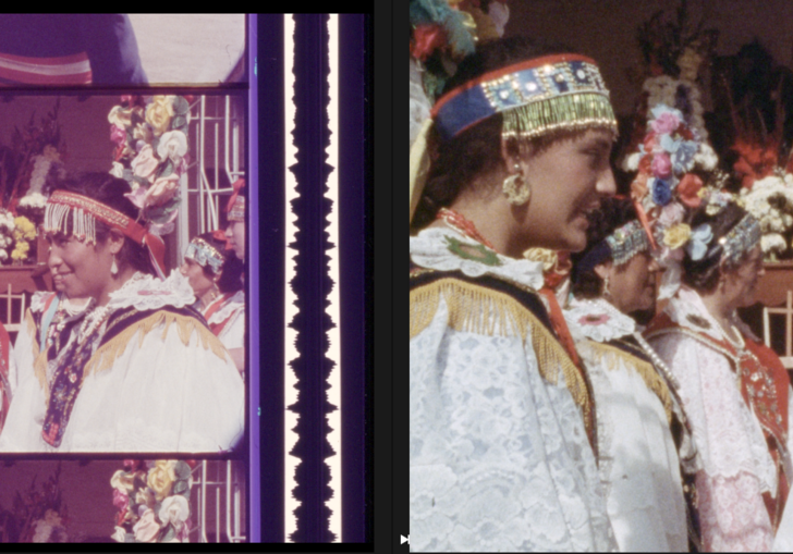 A 35mm film still of a group of women dressed up for ceremony in white clothes and headdresses.