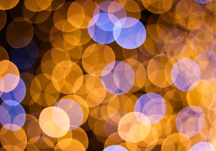 Abstract image of blurred lights in shades of yellow and blue