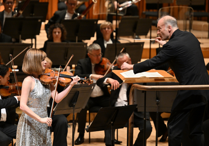 Violinist Lisa Batiashvili and conductor Gianandrea Noseda perform on the Babrican Hall stage