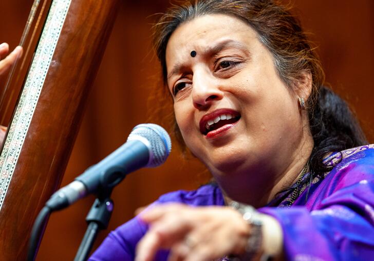 Ashwini Bhide Deshpande singing into a microphone
