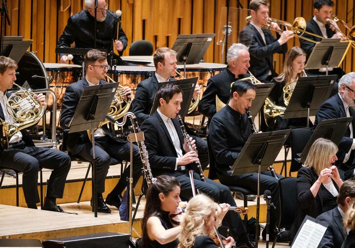 London SymphonyOrchestra performing on the Barbican Hall stage.
