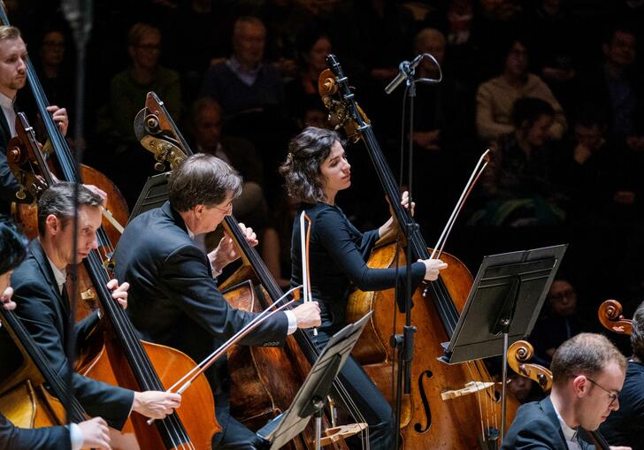 London SymphonyOrchestra  performing on the Barbican Hall stage.