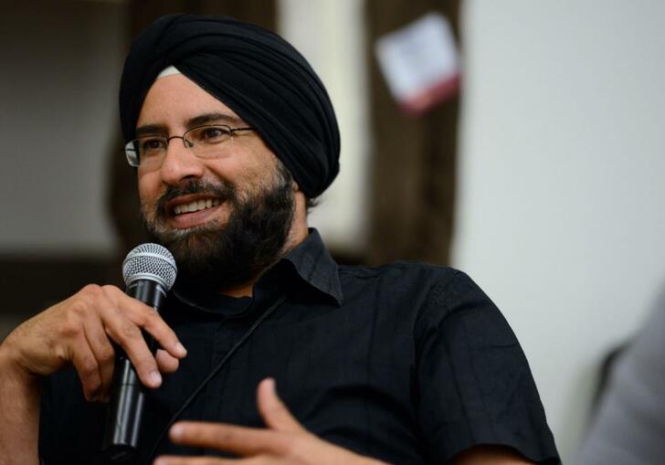 Arvind Pal Singh Mandair talking into a microphone