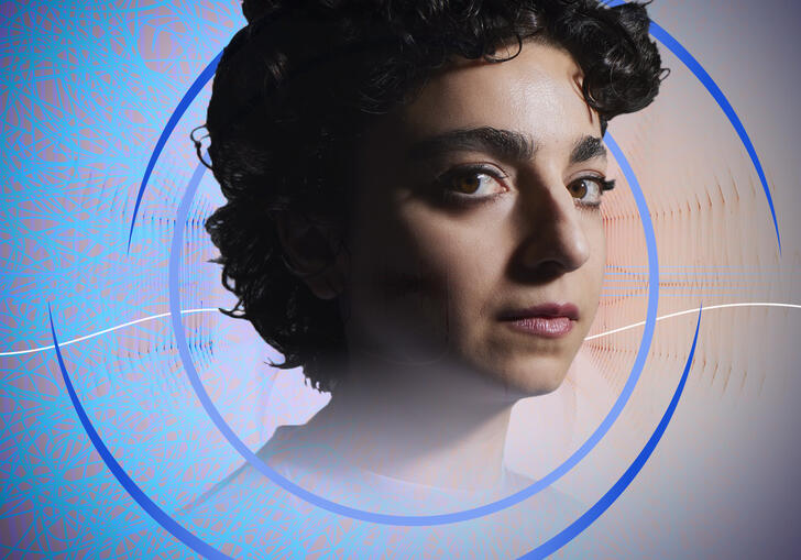 A headshot of Shiva Feshareki, with circular blue swirls around her. In the background is an abstract, blue, web-like pattern and some wavy shapes suggestive of sound waves.