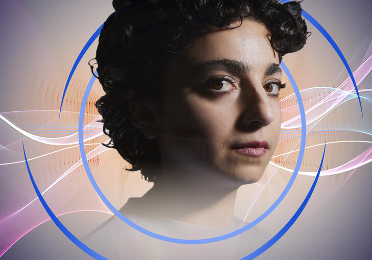 A headshot of Shiva Feshareki, with circular blue swirls around her. In the background are pink and white wavy shapes suggestive of soundwaves.