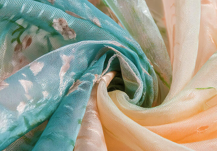 Silk chiffon fabric with a floral pattern, twisted to form a swirl