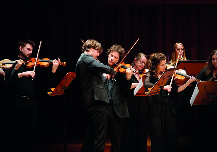 Musicians from Britten Sinfonia performing on stage