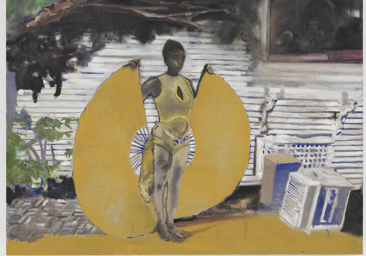 A painting of Davis's wife Karon, holding two golden wings at her sides, reminiscent of a winged goddess. She is in front of the grey wooden wall of the house, and the branches of tree looming over her. By her side there's a box and an old appliance.