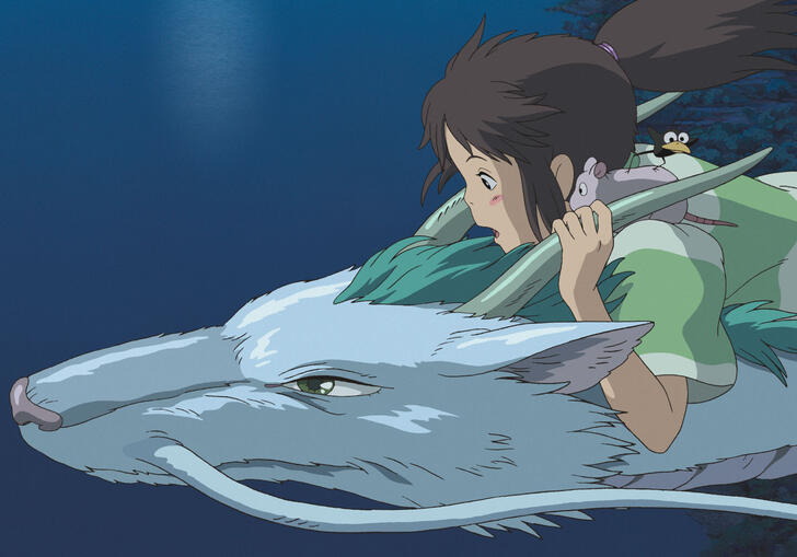 A girl rides on the back of a dragon-like creature over water. 