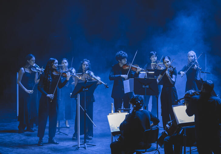 12 Ensemble performing on stage