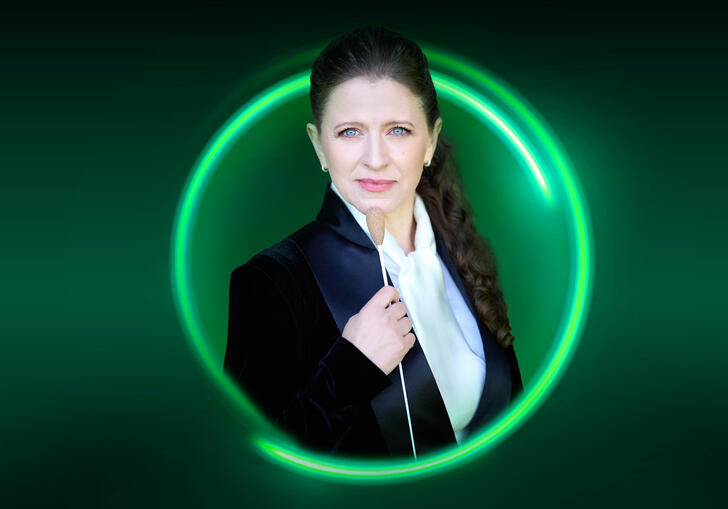 An image of Kristiina Poska surrounded bya green circle against a green background