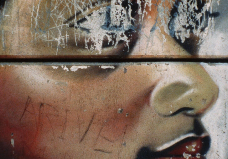 A drawing of a Black child with scratched out eyes