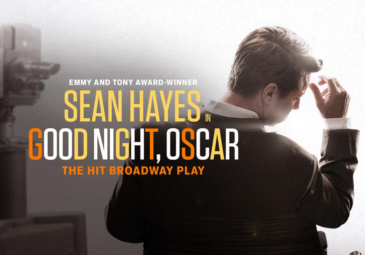 Sean Hayes stands with his back to camera in a suit. The words 'Sean Hayes, Good Night, Oscar' are written in orange and white text over the top'. 