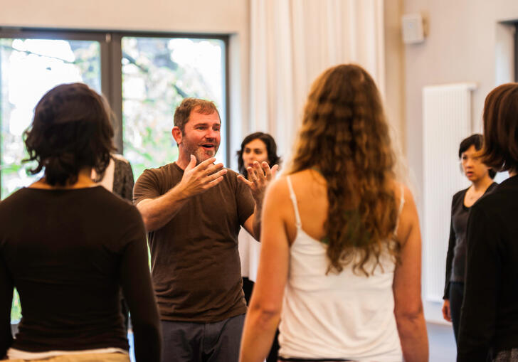 An image of participants in a singing workshop. 