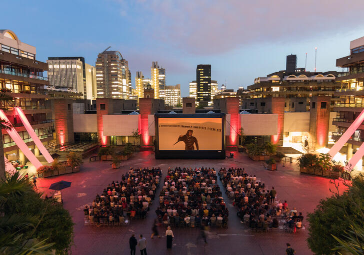 A shot of a large outdoor cinema screen in our Sculpture Court. 