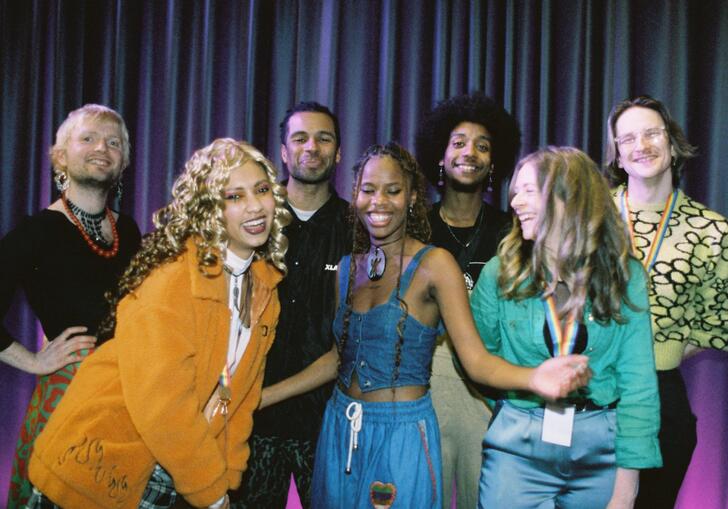 A group shot of people enjoying each other's company. 
