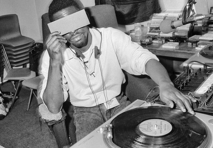 DJ Tee broadcast from three-year-old pirate radio station Kiss-FM studio. Photo by Jeff Veitch.