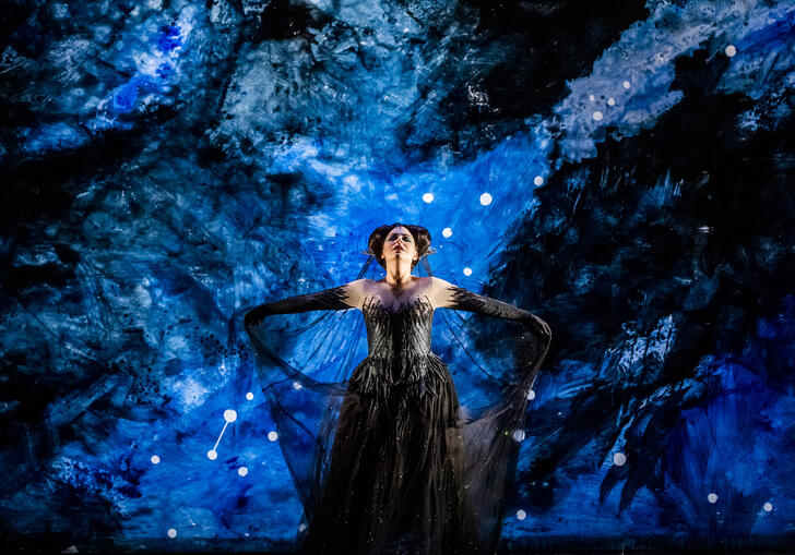 Tuuli Takala as Queen of the Night on a bright blue background
