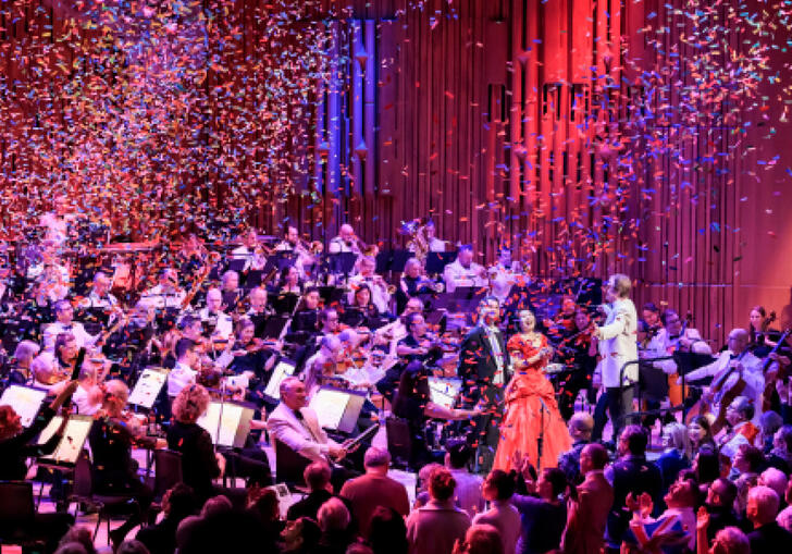Mid-performance image of the London Concert Orchestra with confetti falling everywhere