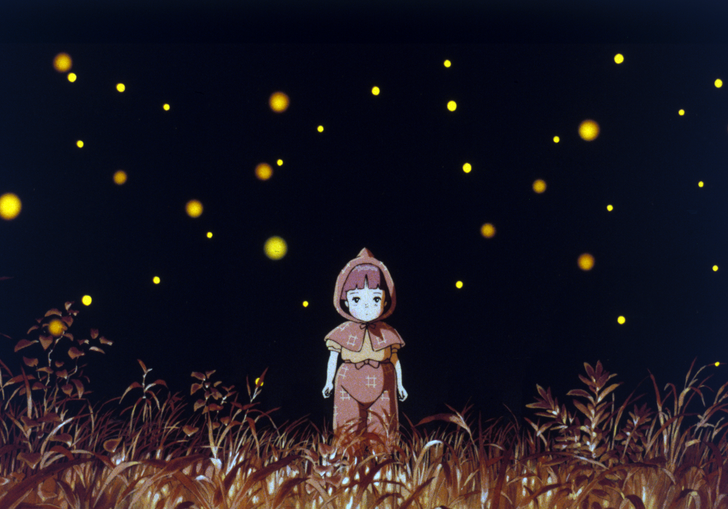 A young girl stands in a dark landscape surrounded by fireflies.