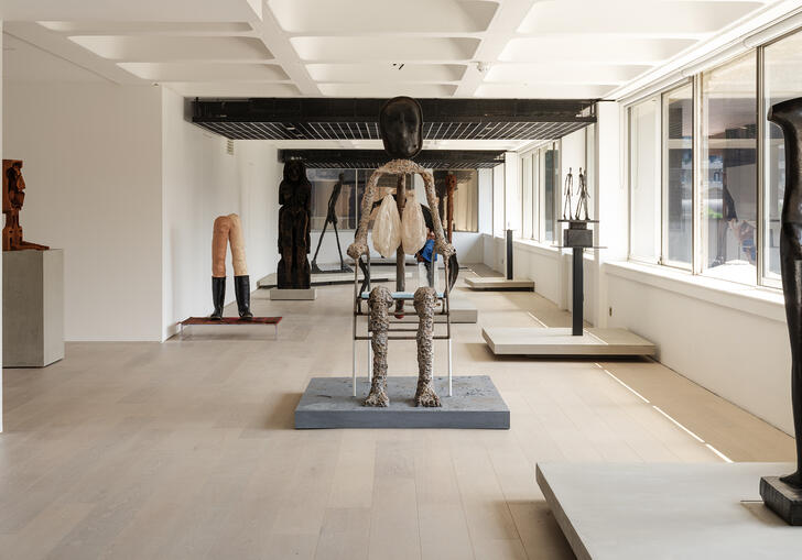 A shot of the gallery, showing sculptures by Giacometti and Huma Bhabha.